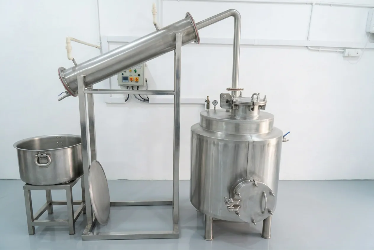 Prabhat's stainless-steel distillation still with an angled condenser, used to make herbal arqs and hydrosols, at our Amritsar factory