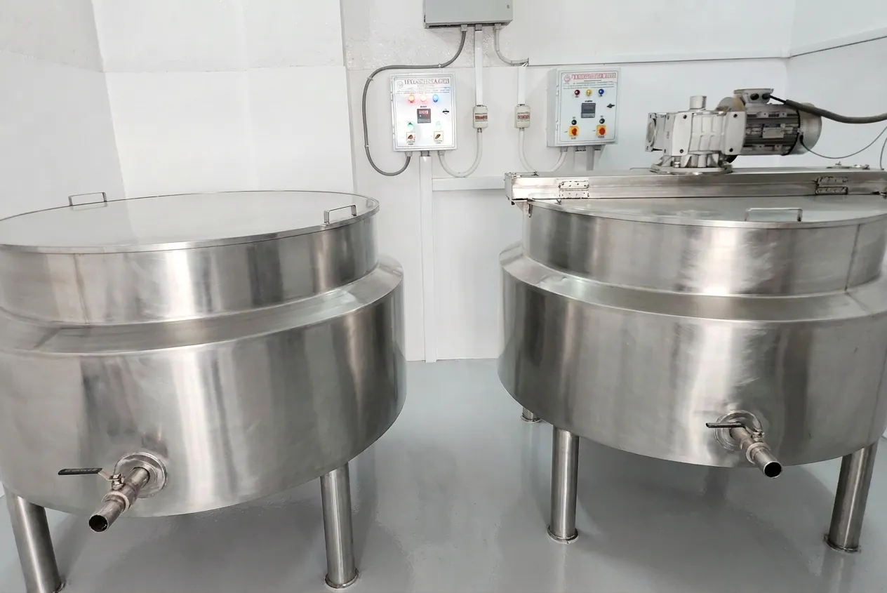 Two stainless-steel steam-jacketed kettles for preparing kwaths and syrups at Prabhat's Amritsar factory